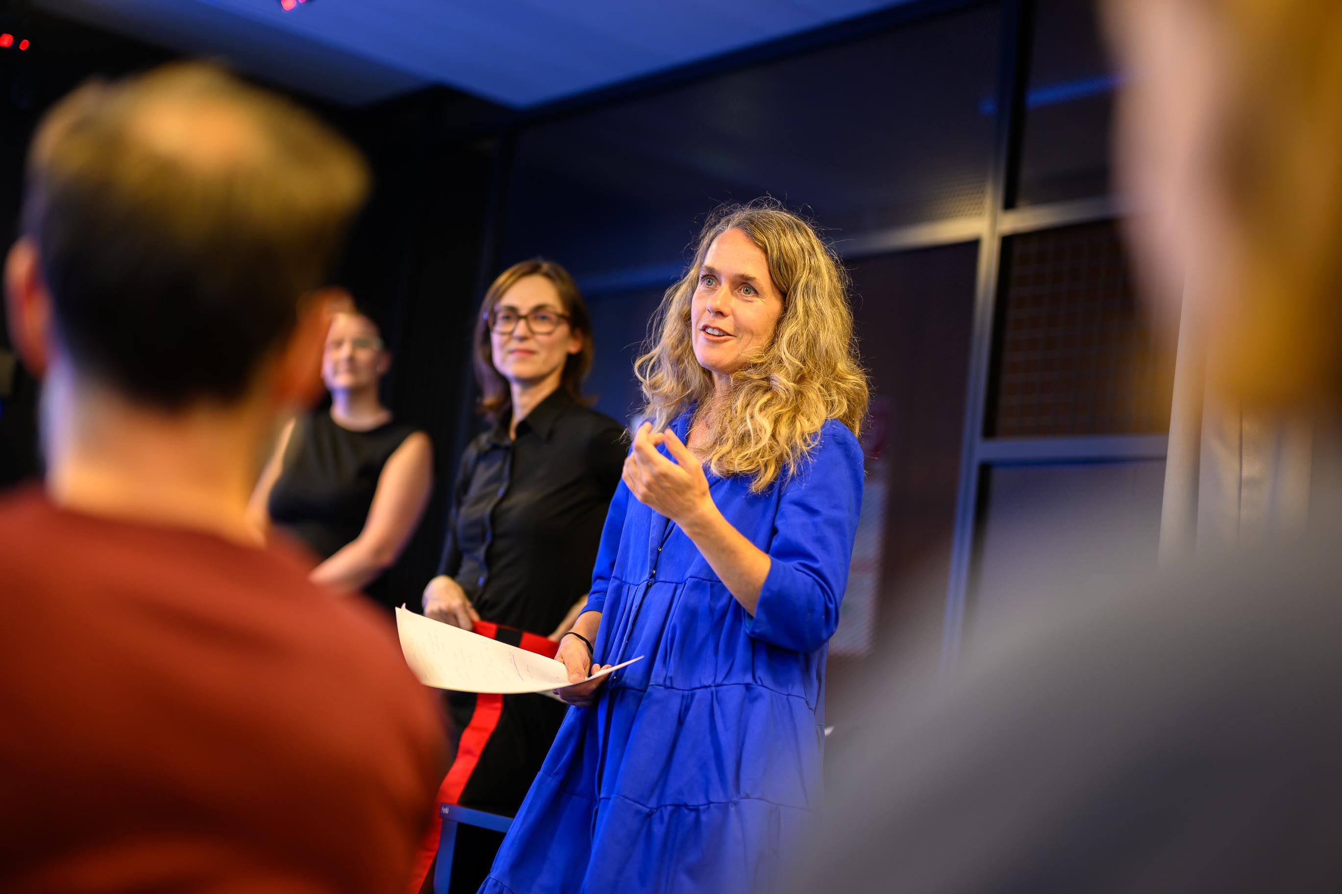 Regina Hügli of One Body of Water moderating an interdisciplinary talk at Vienna Design Week 2024.